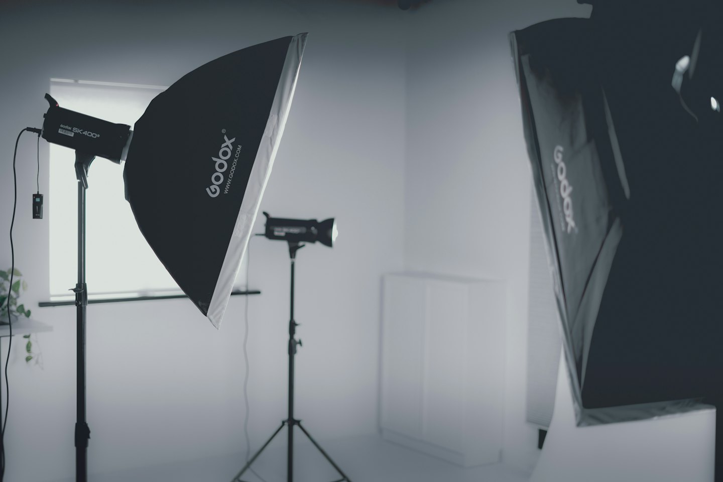 Photography studio setup with strobes and softboxes.